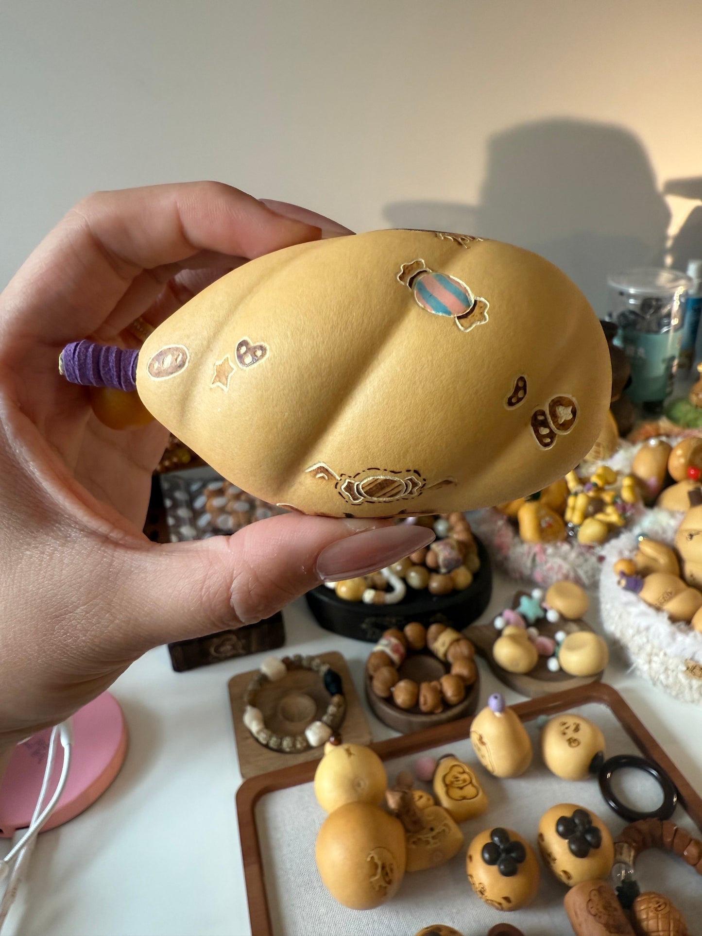 Hand-polished bread-shaped gourd โ warm color and soft texture, like freshly baked bread.