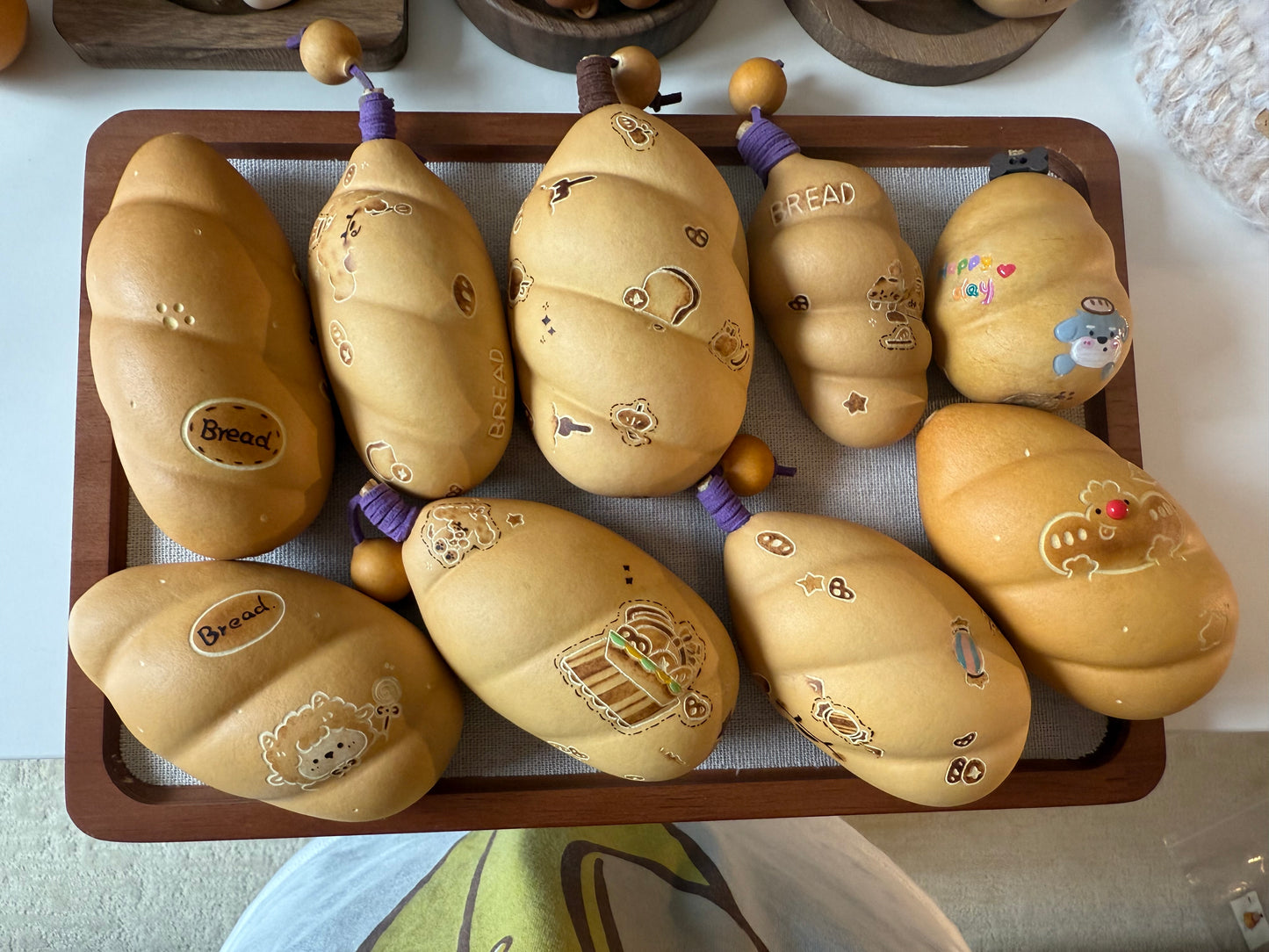 Hand-polished bread-shaped gourd โ warm color and soft texture, like freshly baked bread.