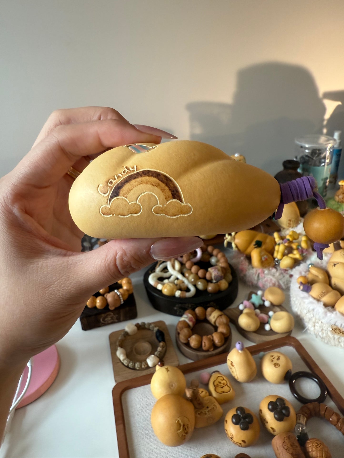 Hand-polished bread-shaped gourd โ warm color and soft texture, like freshly baked bread.