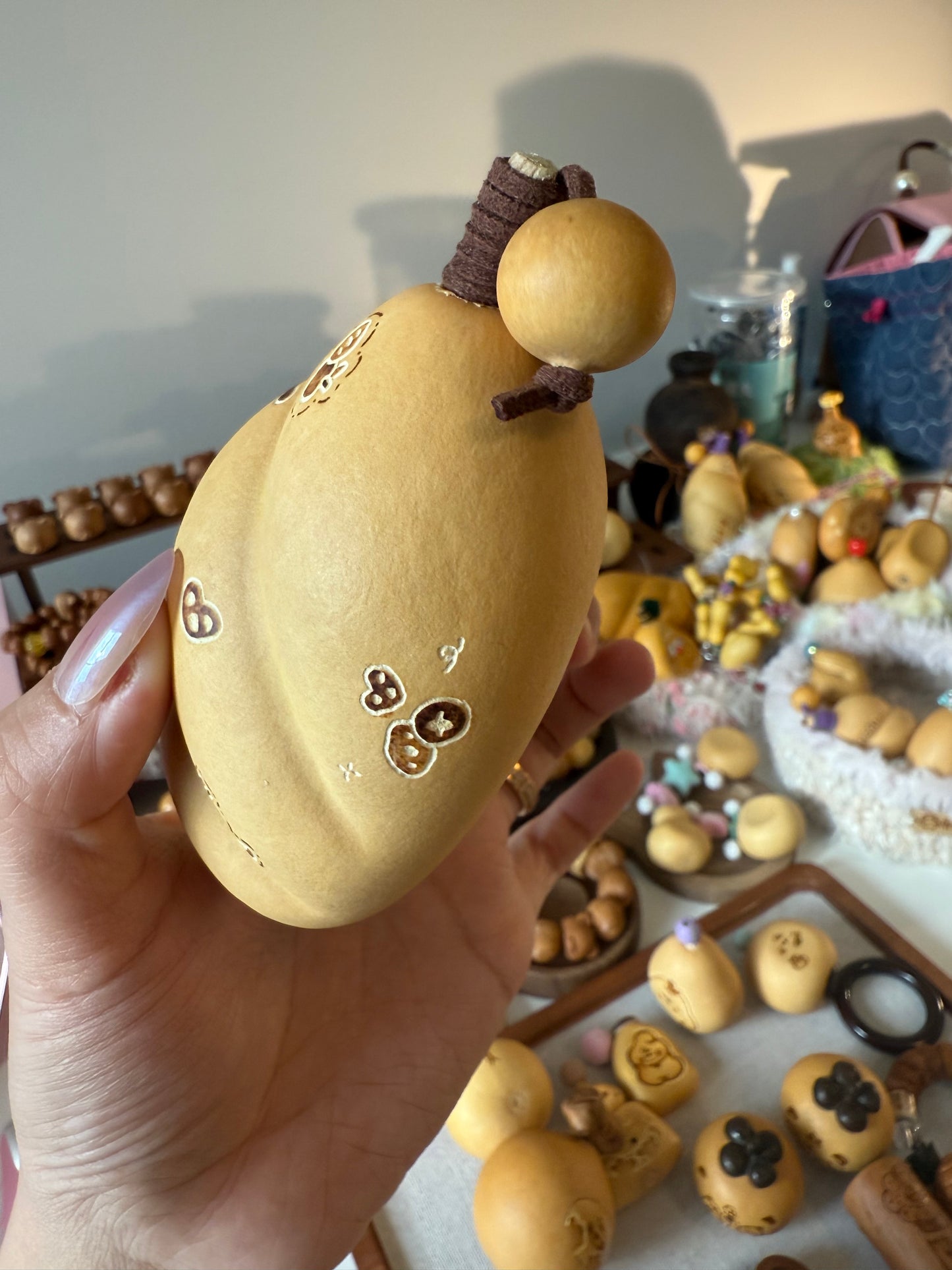 Hand-polished bread-shaped gourd โ warm color and soft texture, like freshly baked bread.