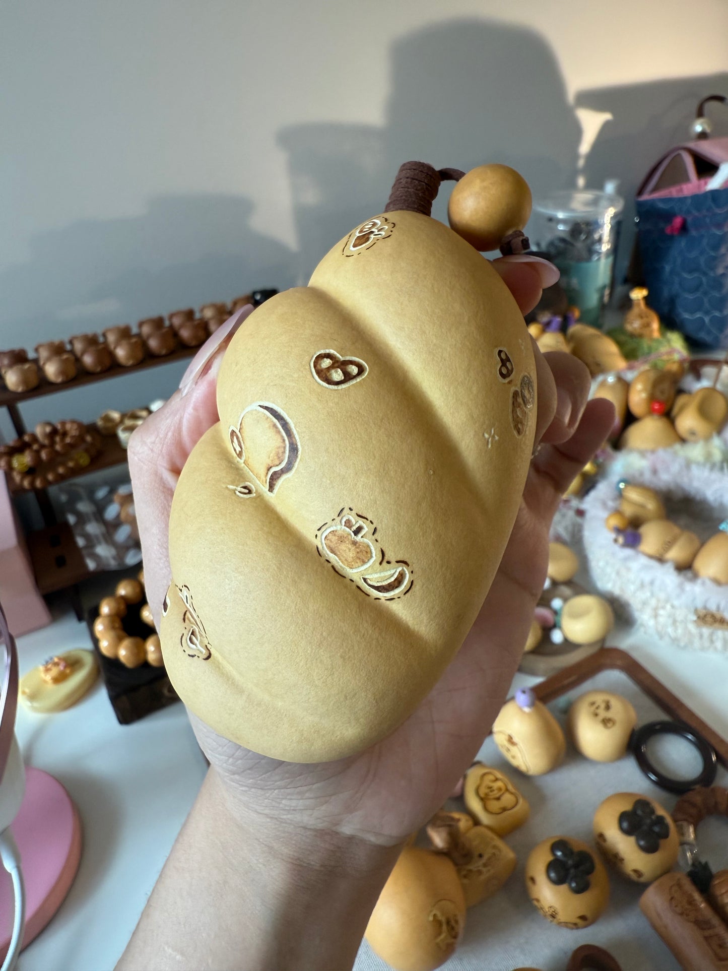 Hand-polished bread-shaped gourd โ warm color and soft texture, like freshly baked bread.