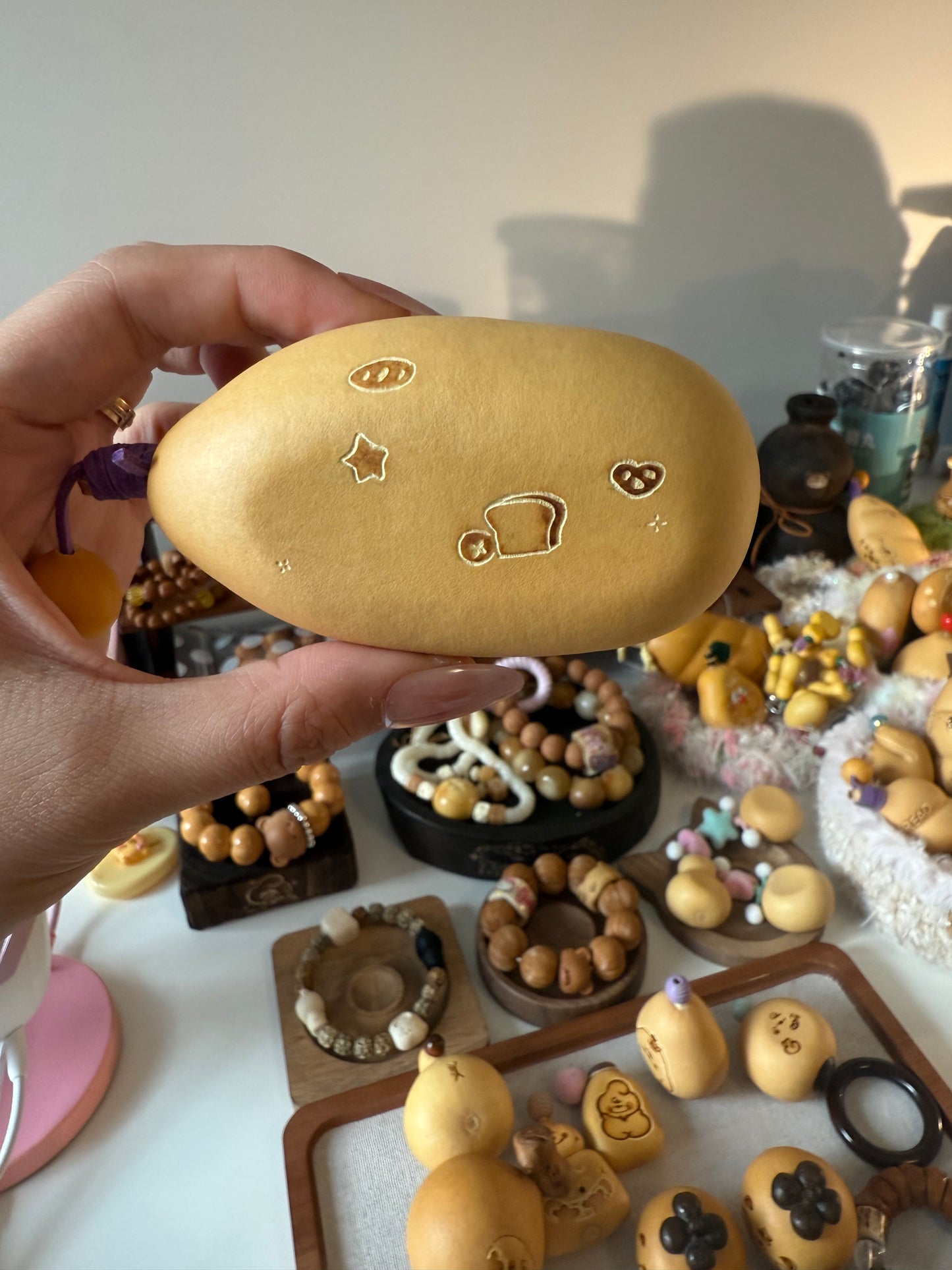 Hand-polished bread-shaped gourd — warm color and soft texture, like freshly baked bread.