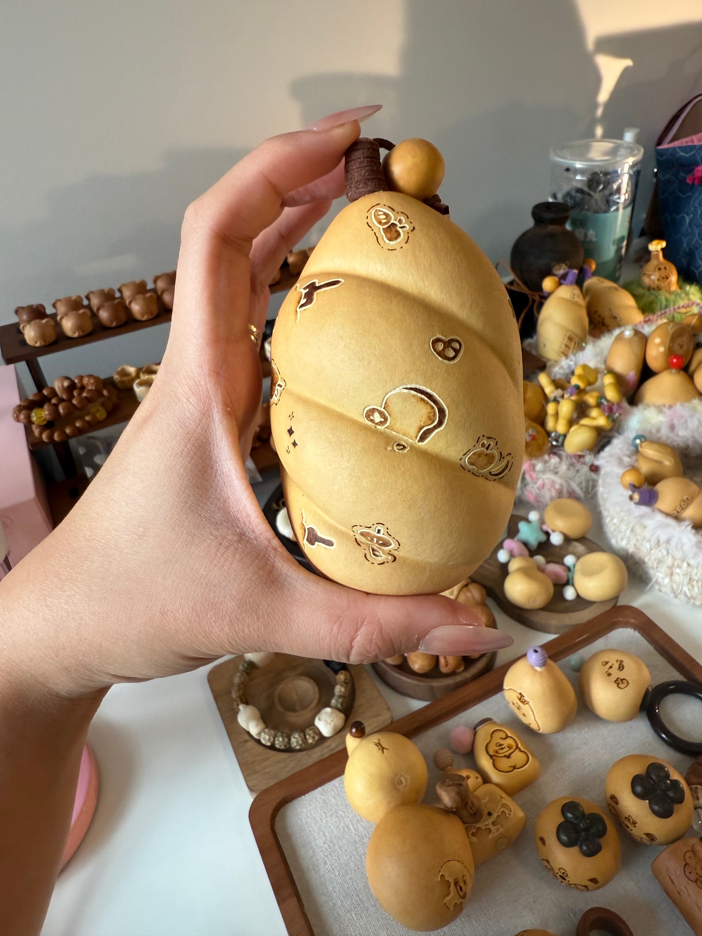 Hand-polished bread-shaped gourd — warm color and soft texture, like freshly baked bread.