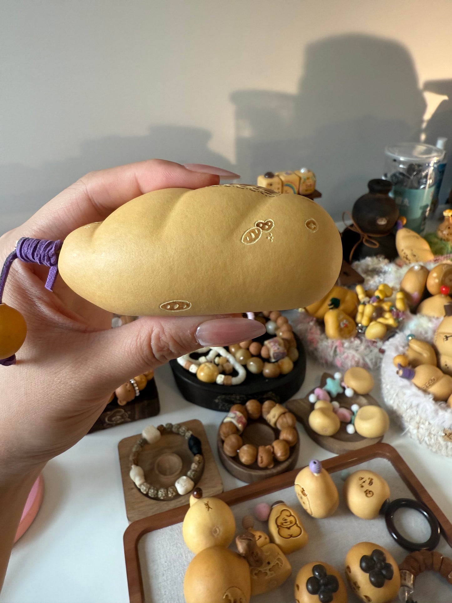 Hand-polished bread-shaped gourd — warm color and soft texture, like freshly baked bread.